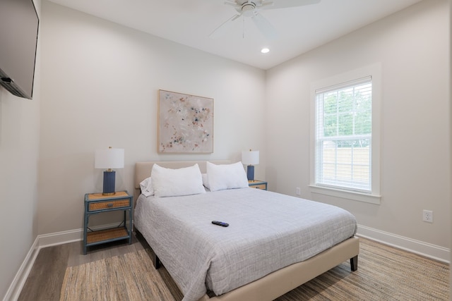 bedroom with hardwood / wood-style floors and ceiling fan