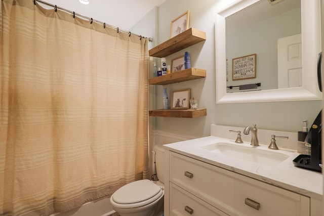 bathroom featuring vanity and toilet