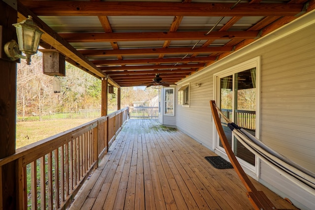 wooden deck featuring ceiling fan