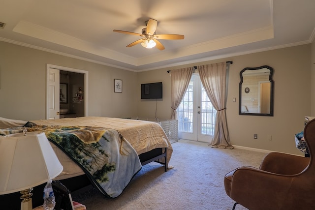 carpeted bedroom with french doors, ornamental molding, access to exterior, and a raised ceiling