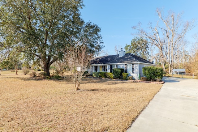 ranch-style home with a front lawn