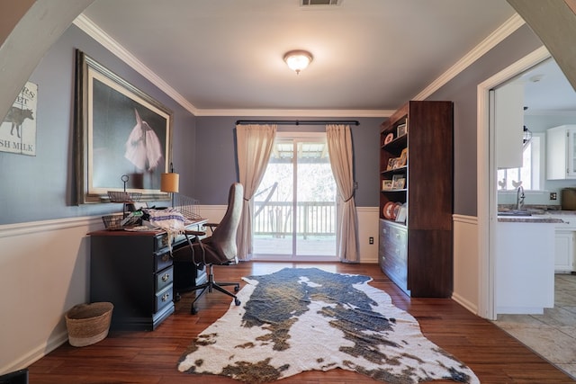 home office with ornamental molding, dark wood-type flooring, and sink