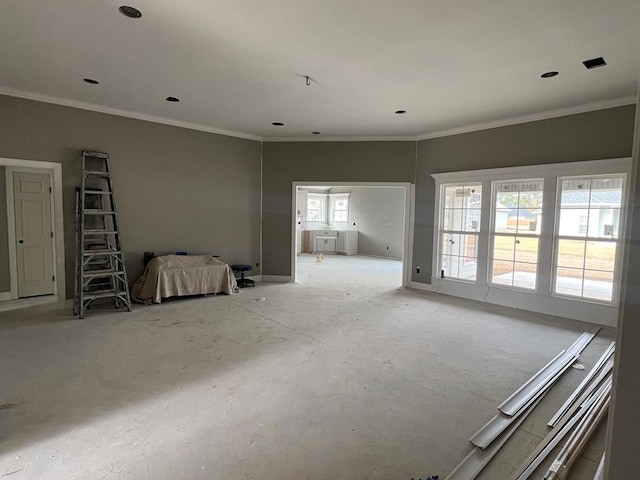 unfurnished living room with ornamental molding