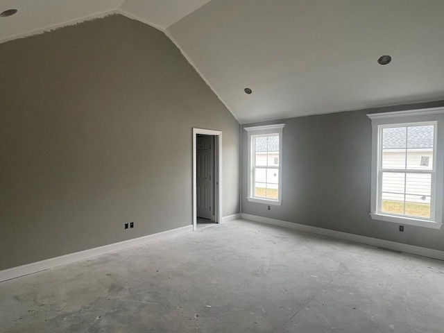 empty room with vaulted ceiling