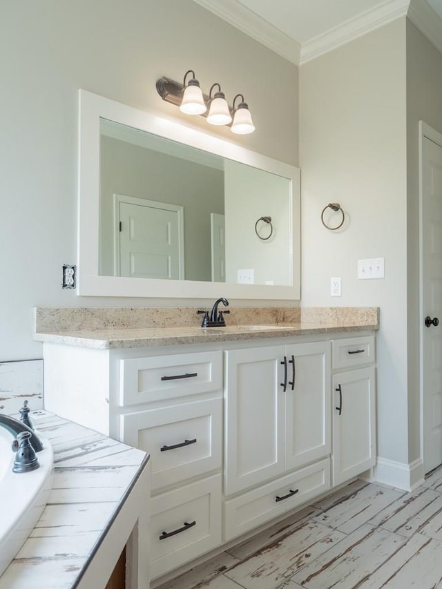 bathroom featuring crown molding and vanity