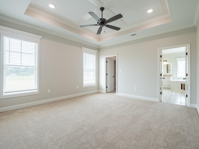 interior space featuring light carpet, multiple windows, ensuite bath, and ceiling fan