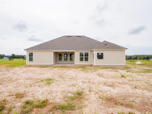 rear view of property featuring a patio