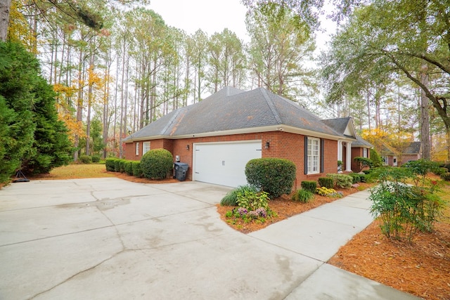 view of side of home with a garage