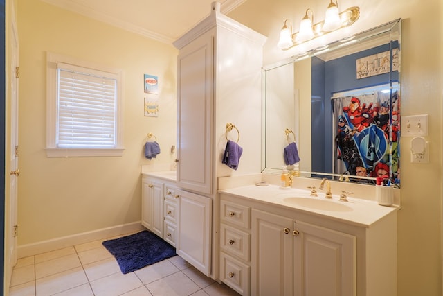 bathroom with tile patterned flooring, vanity, and crown molding