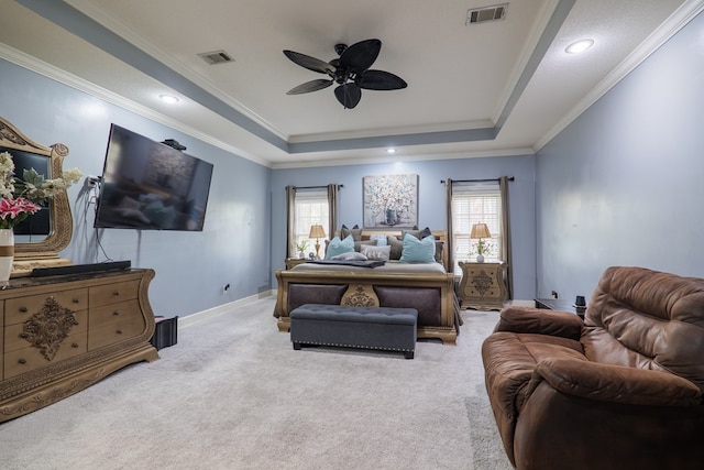 bedroom featuring light carpet, a raised ceiling, and ceiling fan