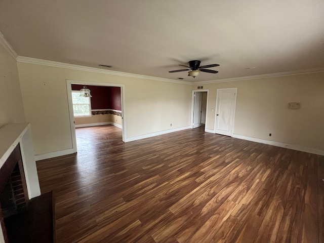 unfurnished living room with dark wood-style flooring, a brick fireplace, visible vents, and crown molding