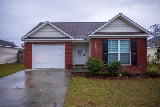 ranch-style home with a front yard and a garage