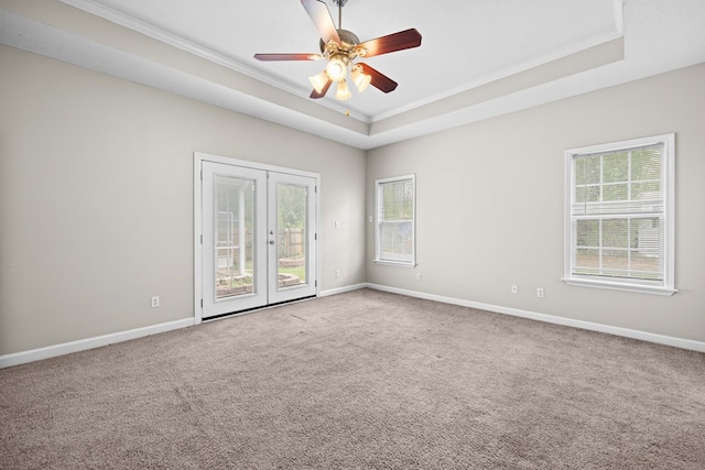 4143 Whithorn Way, Valdosta, GA 31605 - empty room featuring a raised ceiling, ornamental molding, french doors, healthy amount of natural light, and carpet flooring