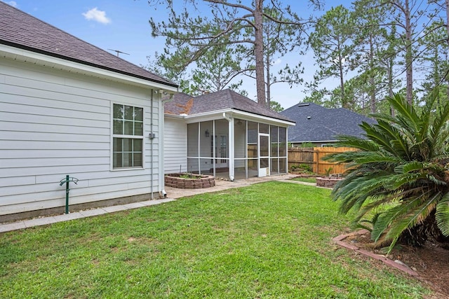 4143 Whithorn Way, Valdosta, GA 31605 - back of house with a sunroom and roof with shingles