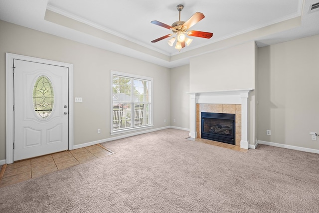 4143 Whithorn Way, Valdosta, GA 31605 - unfurnished living room with carpet floors, a raised ceiling, crown molding, a fireplace, and a ceiling fan