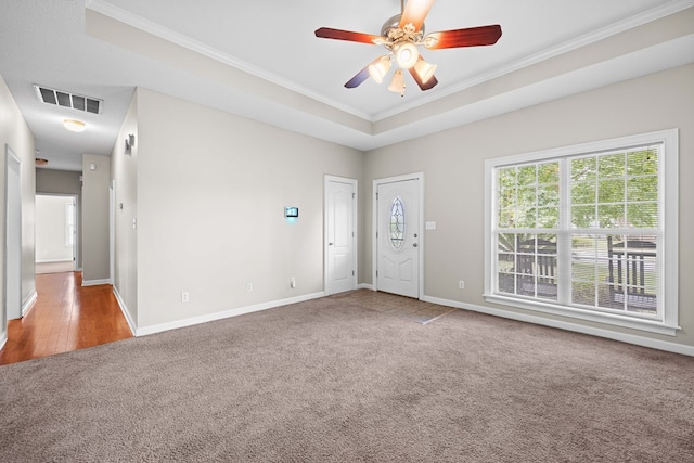 4143 Whithorn Way, Valdosta, GA 31605 - carpeted spare room with ornamental molding, baseboards, ceiling fan, and a tray ceiling