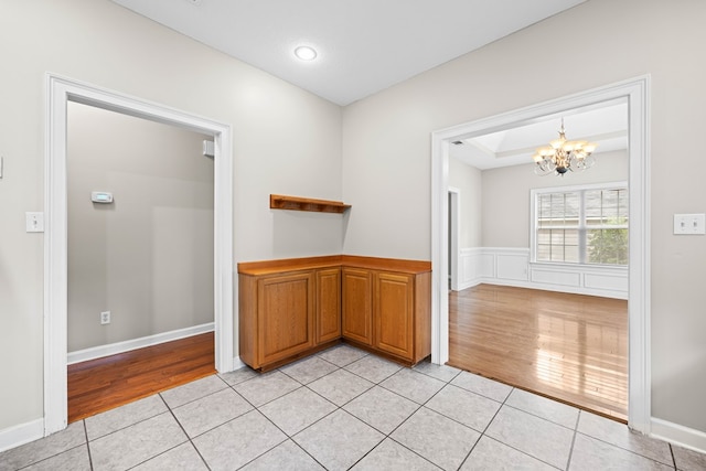 4143 Whithorn Way, Valdosta, GA 31605 - unfurnished dining area featuring a chandelier, light wood finished floors, and baseboards