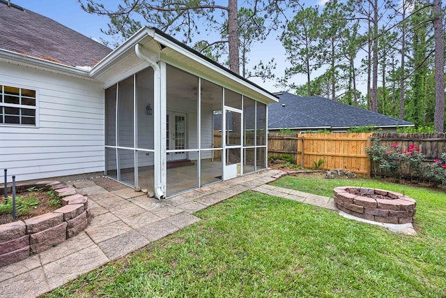 4143 Whithorn Way, Valdosta, GA 31605 - view of yard featuring a sunroom, an outdoor fire pit, and a patio area