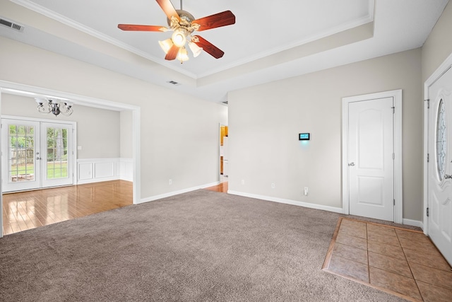 4143 Whithorn Way, Valdosta, GA 31605 - spare room featuring carpet floors, a raised ceiling, crown molding, ceiling fan, and a chandelier