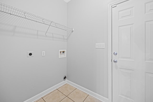 4143 Whithorn Way, Valdosta, GA 31605 - laundry area with hookup for an electric dryer, washer hookup, baseboards, and light tile patterned floors