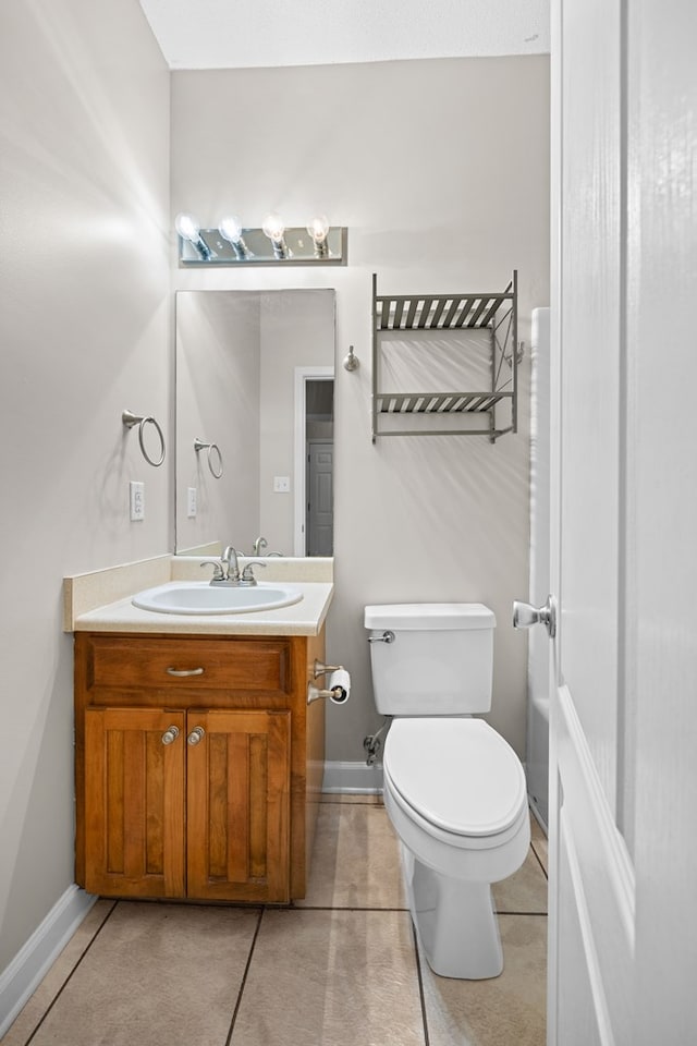 4143 Whithorn Way, Valdosta, GA 31605 - bathroom featuring vanity, toilet, baseboards, and tile patterned floors