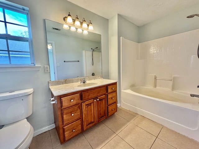 full bathroom with tub / shower combination, tile patterned floors, a textured ceiling, toilet, and vanity