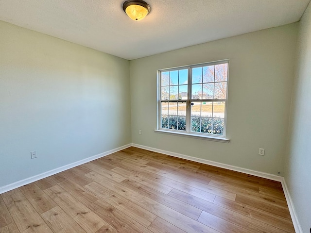 spare room featuring light hardwood / wood-style flooring