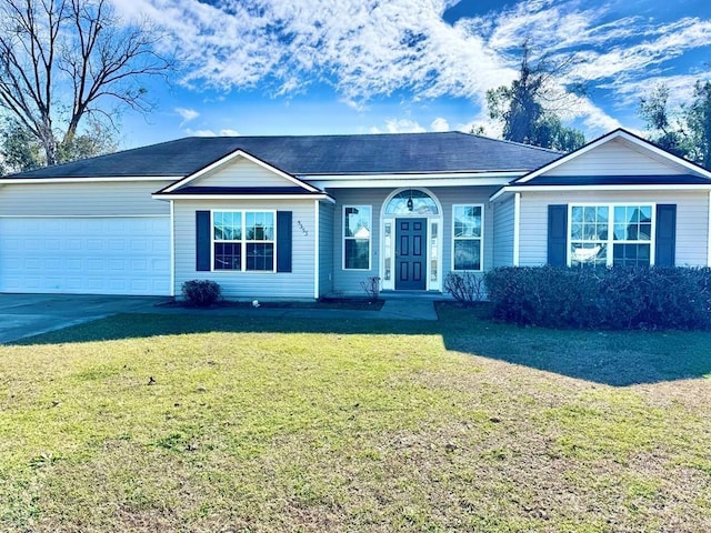 ranch-style house featuring a front yard and a garage