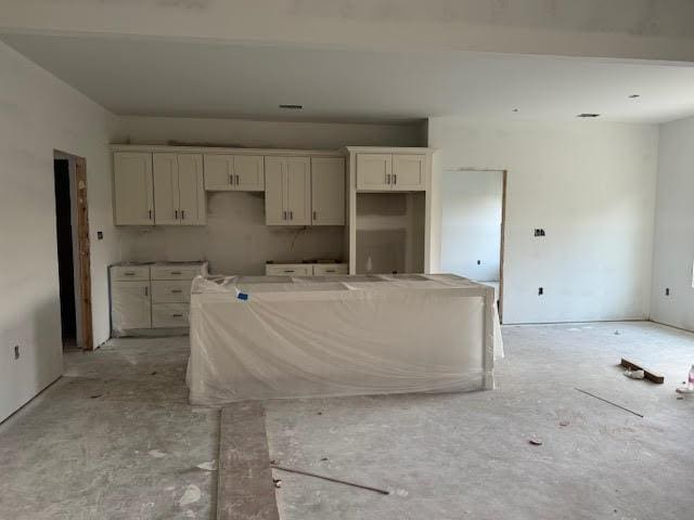 3824 Merriman Ct, Valdosta, GA 31605 - kitchen with a kitchen island and white cabinets