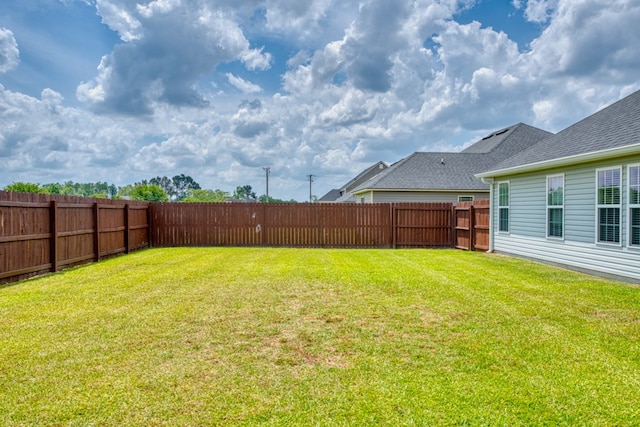 view of yard featuring a fenced backyard