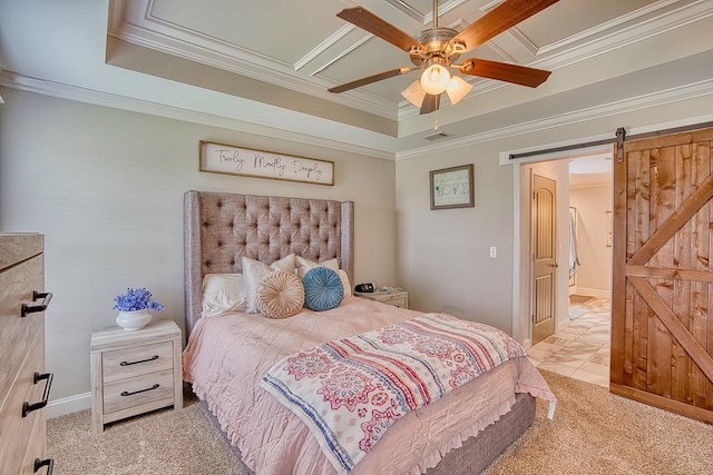 carpeted bedroom with a barn door, a ceiling fan, a raised ceiling, ornamental molding, and visible vents