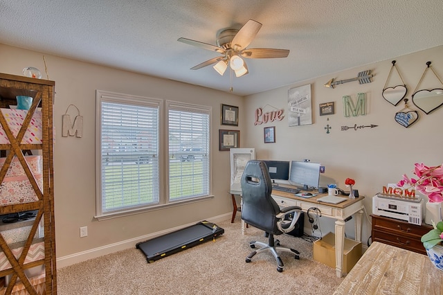 office featuring carpet floors, a textured ceiling, and a ceiling fan