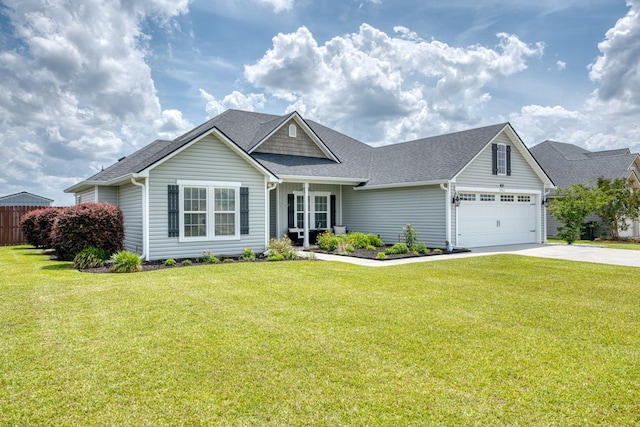 view of front of home featuring roof with shingles, a front yard, and concrete driveway