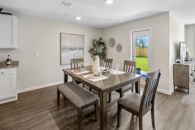 dining area with baseboards, visible vents, wood finished floors, and recessed lighting