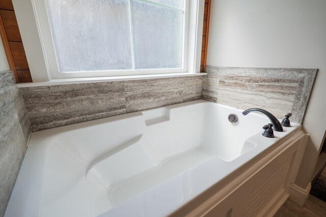 bathroom with a tub