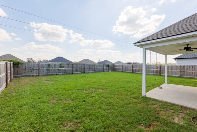 view of yard featuring ceiling fan and a patio area