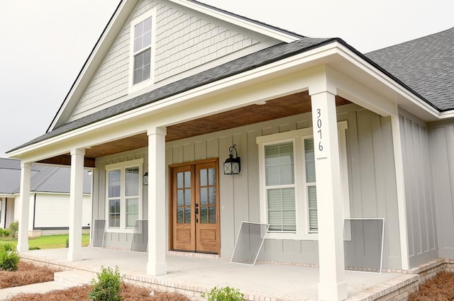 3039 Mary Powell Way, Hahira, GA 31632 - entrance to property with covered porch, roof with shingles, board and batten siding, and french doors