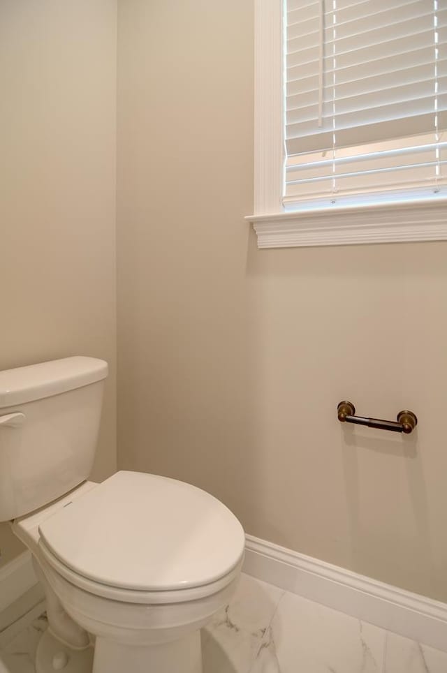3039 Mary Powell Way, Hahira, GA 31632 - bathroom featuring marble look tiles, toilet, and baseboards