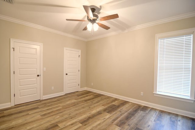 3039 Mary Powell Way, Hahira, GA 31632 - unfurnished room featuring ceiling fan, wood finished floors, crown molding, baseboards, and plenty of natural light