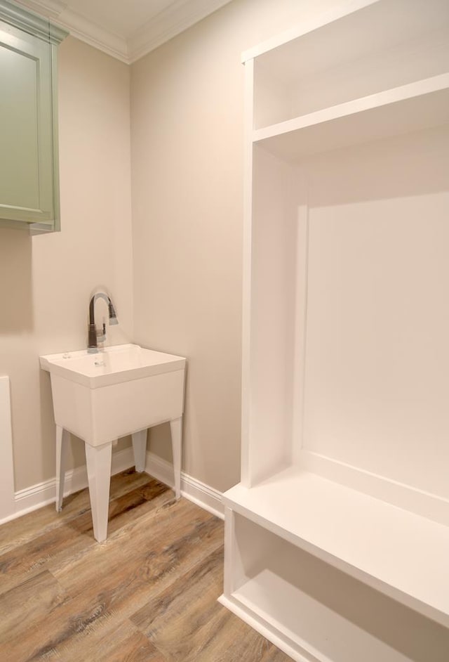 3039 Mary Powell Way, Hahira, GA 31632 - bathroom with crown molding, wood finished floors, and baseboards