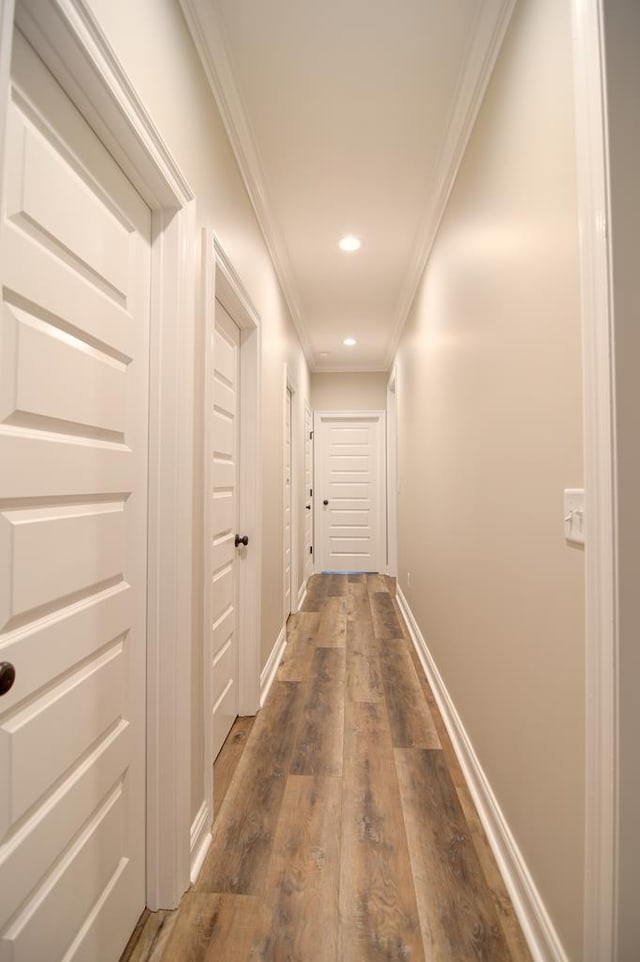 3039 Mary Powell Way, Hahira, GA 31632 - hallway featuring crown molding, dark wood-type flooring, baseboards, and recessed lighting