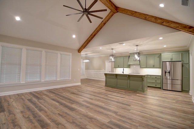 3039 Mary Powell Way, Hahira, GA 31632 - unfurnished living room featuring beamed ceiling, ceiling fan, high vaulted ceiling, a decorative wall, and a sink