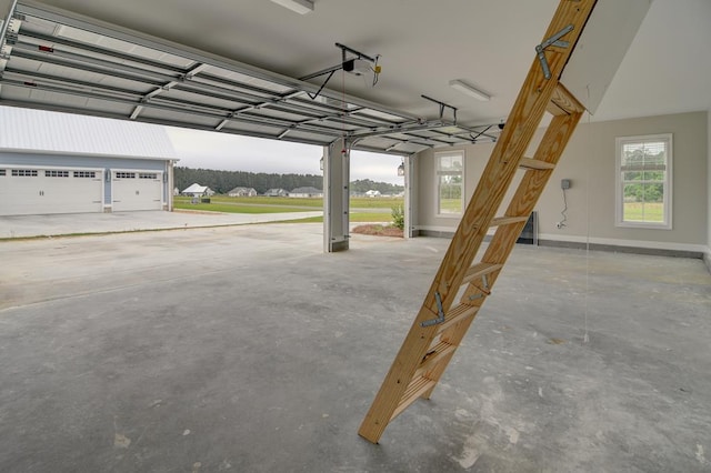 3039 Mary Powell Way, Hahira, GA 31632 - garage featuring baseboards and a garage door opener