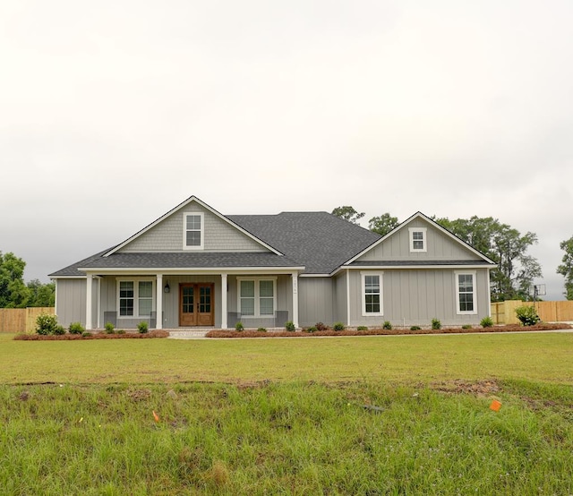 3039 Mary Powell Way, Hahira, GA 31632 - view of front facade featuring a shingled roof, board and batten siding, and french doors