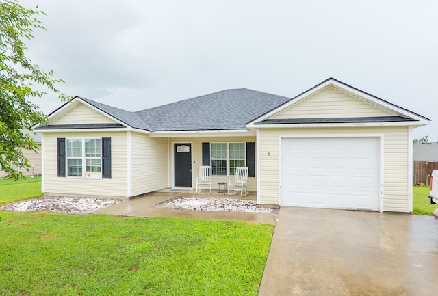 5187 Calvary Cir, Valdosta, GA 31605 - single story home with a porch, a front lawn, driveway, an attached garage, and roof with shingles