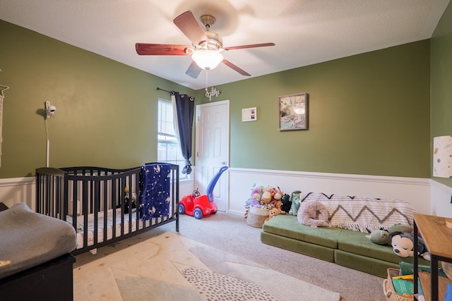 5187 Calvary Cir, Valdosta, GA 31605 - carpeted bedroom featuring wainscoting and ceiling fan