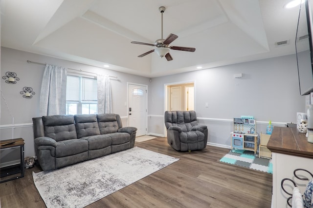 5187 Calvary Cir, Valdosta, GA 31605 - living area featuring a tray ceiling, ceiling fan, wood finished floors, and recessed lighting