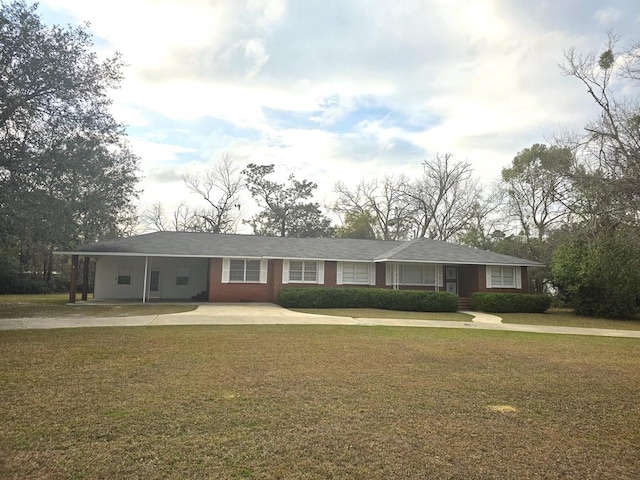 ranch-style home with a carport and a front yard