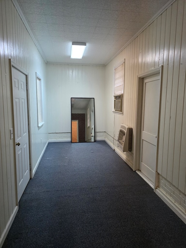 carpeted spare room featuring cooling unit, ornamental molding, and an AC wall unit