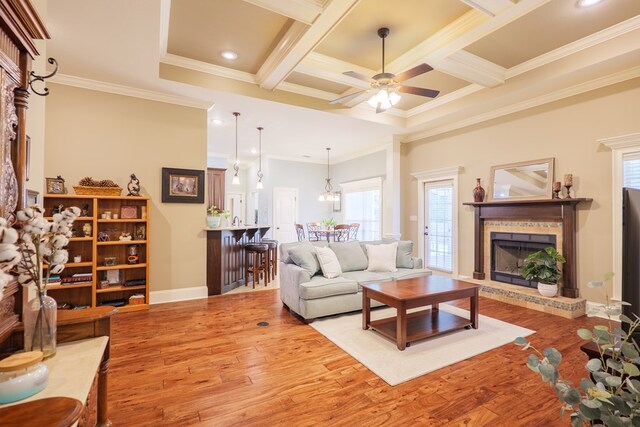 5080 Carlton Ridge Cir, Hahira, GA 31632 - living area featuring a brick fireplace, wood finished floors, crown molding, recessed lighting, and a ceiling fan